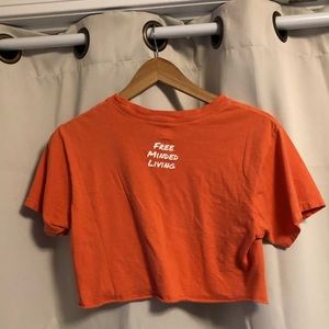 salmon colored cropped t shirt with emoji
